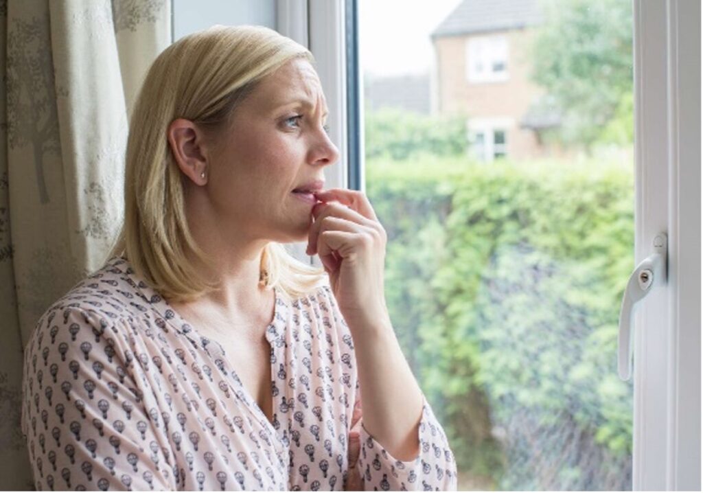 Depiction of a women looking out a window to symbolise anxiety as this is the mental health issue discussed here
